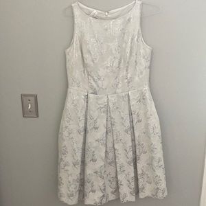 Cream/silver dress.  Size 8. Cute small flare fit.  Hits above knee.